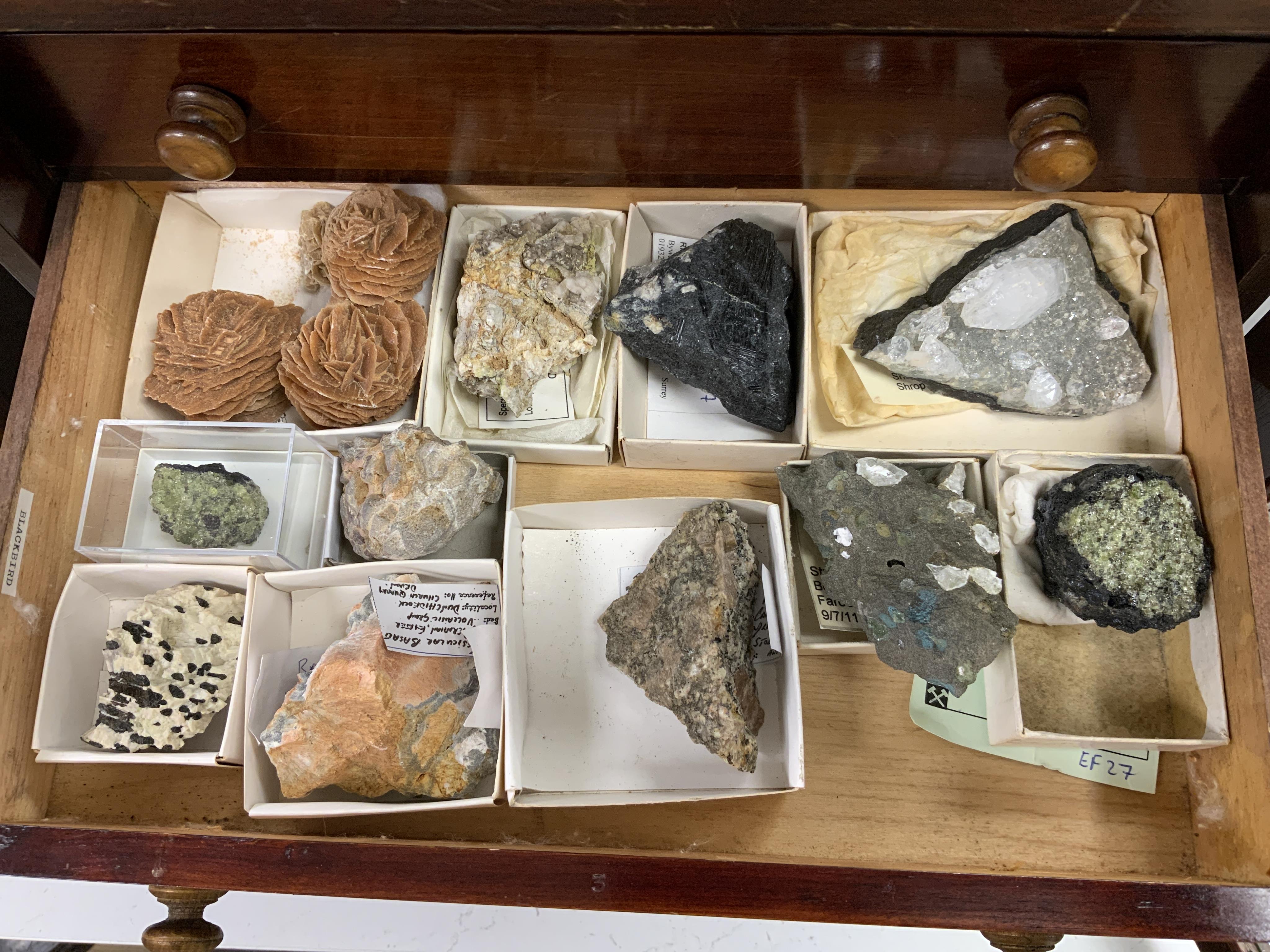 An early twentieth century six drawer pine collector’s cabinet of mineral and crystal samples including; Amber and insects in amber, Baryteson Calcite, Aplite, Nodular Rhyolite, Desert Roses, etc. many specimens with lab